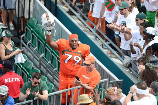 University of Miami Hurricanes offensive lineman Malcolm Bunche #79 celebrates with fans after the Canes upset the #12 ranked University of Florida...