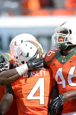 University of Miami Hurricanes tight end Clive Walford #46 celebrates with teammates in a game against the Cincinnati Bearcats at Sun Life Stadium on...