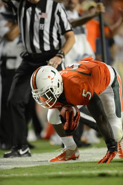 University of Miami Hurricanes running back Mike James #5 carries the ball against the Florida State Seminoles at Sun Life Stadium on October 20,...