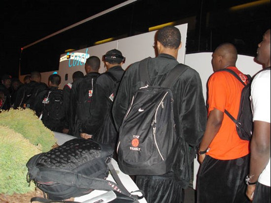 Arriving at the hotel in Charleston and unloading bags from the bus.