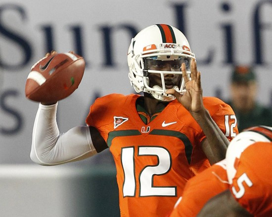 Miami quarterback Jacory Harris looks for an open receiver during the first half of an NCAA college football game against Florida A&M, Thursday,...