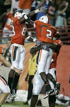 Miami running back Graig Cooper celebrates with Sam Shields, left, after scoring a touchdown in the first quarter. (AP Photo/Lynne Sladky)
