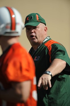 University of Miami Offensive Line Coach, Art Kehoe, instructs his team on how he wants them to execute his game plan during a spring practice at...