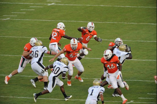 The University of Miami offense plays in a game against the Georgia Tech Yellow Jackets at Sun Life Stadium on October 22, 2011.  Photo by Steven...