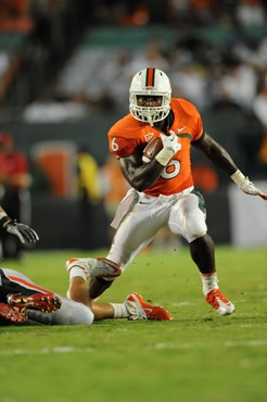 University of Miami Hurricanes running back Lamar Miller #6 carries the ball against the Ohio State Buckeyes at Sun Life Stadium on September 17,...
