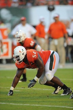 University of Miami Hurricanes defensive lineman Micanor Reqis #54 plays in a game against the Clemson Tigers at Land Shark Stadium on October 24,...