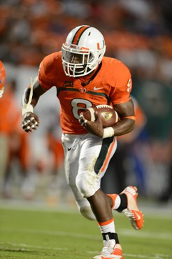 University of Miami Hurricanes running back Duke Johnson #8 scores a touchdown in a game against the Savannah State Tigers at Sun Life Stadium on...