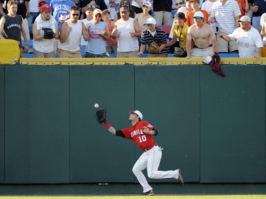 Georgia center fielder Matt Cerione (10) catches a fly ball hit by Miami's Yonder Alonso in the fifth inning of an NCAA College World Series baseball...
