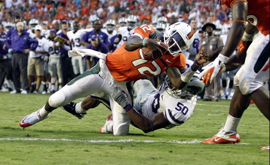 Kansas State's Tre Walker (50) stops Miami quarterback Jacory Harris (12) short of the goal line. Kansas State defeated Miami 28-24. (AP Photo/J Pat...