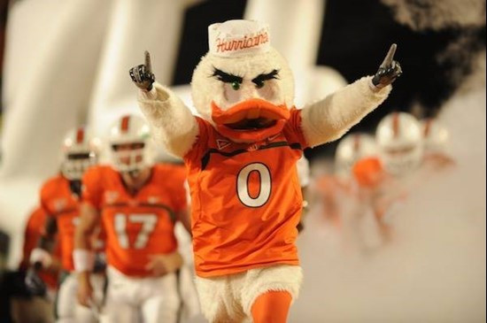 Sebastian the Ibis leads the University of Miami Hurricanes through a tunnel of smoke in  a game against the Georgia Tech Yellow Jackets at Land Shark...