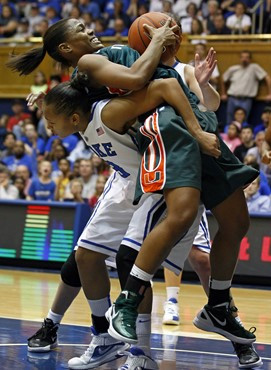 Miami's Krystal Saunders, top, and Duke's Shay Selby struggle for possession during the second half. (AP Photo/Gerry Broome)