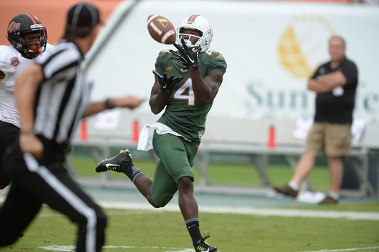 ass from quarterback Brad Kaaya in a game against the Arkansas State Red Wolves at Sun Life Stadium on September13, 2014. Photo by Steven & Matthew...