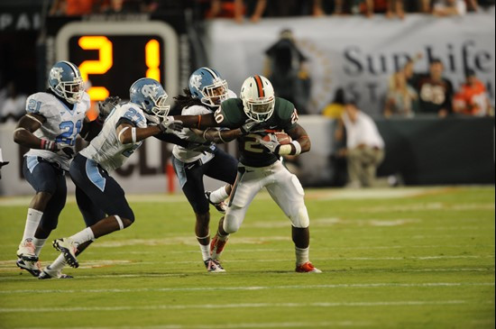 University of Miami Hurricanes running back Damien Berry #20 carries the ball against the North Carolina Tar Heels at Sun Life Stadium on October 23,...