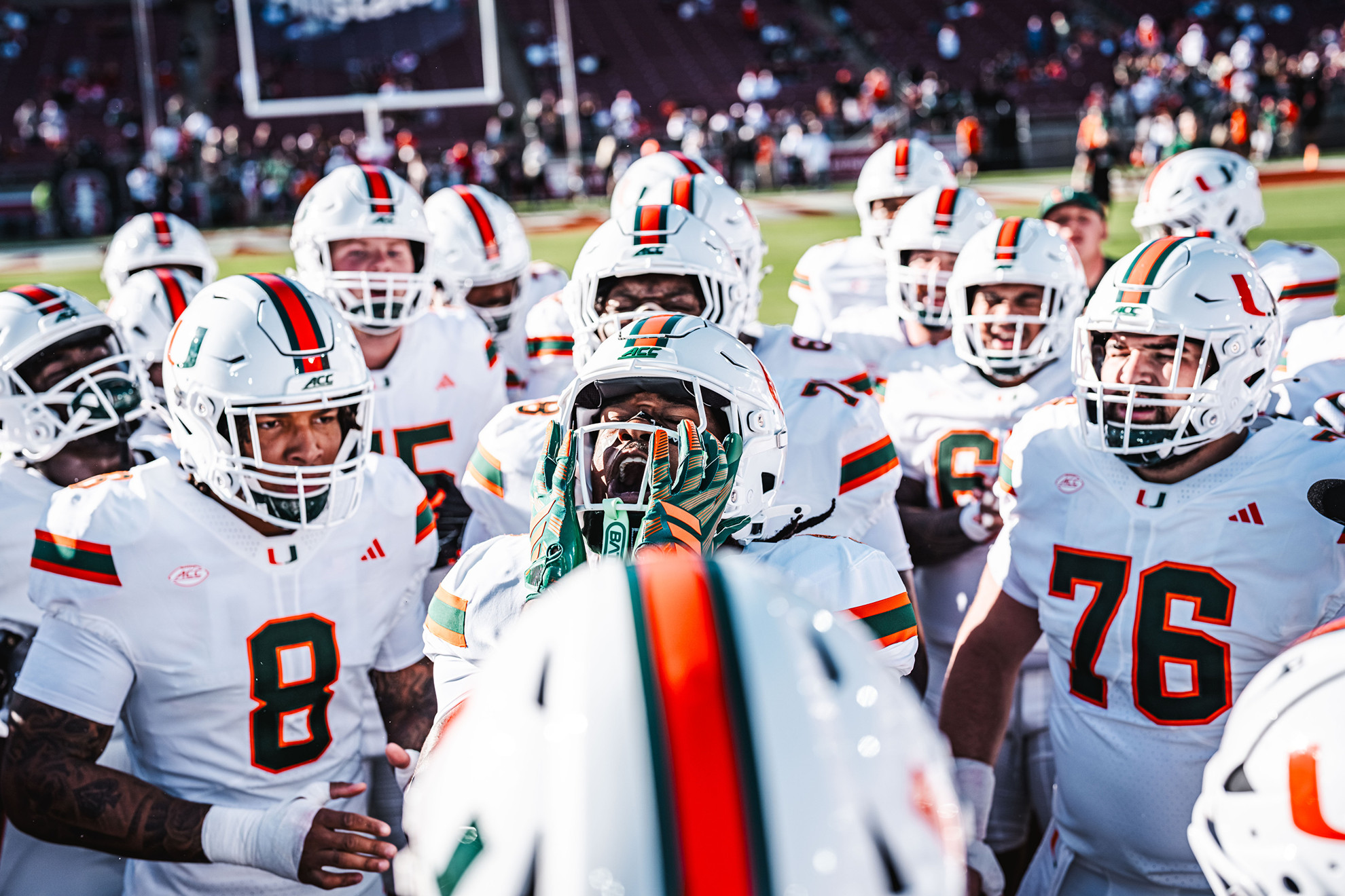 The Hurricanes huddle before taking the field at Stanford