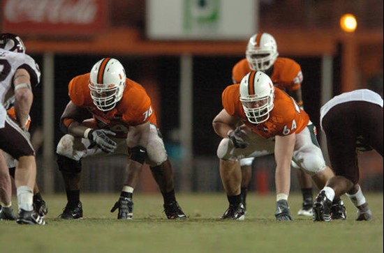 University of Miami offensive lineman Jason Fox #64 and Orlando Franklin #74 get set to block in a game against the Texas A&M Aggies at the Orange...