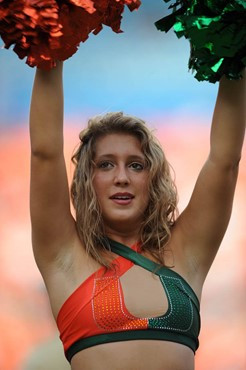 A University of Miami Hurricane cheerleader performs for fans in a game against the University of Central Florida Knights at Dolphin Stadium on...