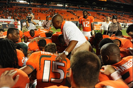 The University of Miami team joins for a prayer after defeating the Ohio State Buckeyes at Sun Life Stadium on September 17, 2011. Photo by Steven...