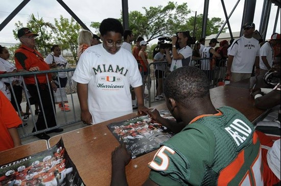 Mike James takes time for the fans before the 2011 Miami Hurricanes Spring Football @ Lockhart Stadium