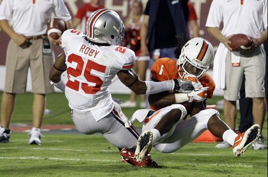 Miami wide receiver Allen Hurns (1) scores a touchdown in front of Ohio State defensive back Bradley Roby (25) during the first quarter of an NCAA...
