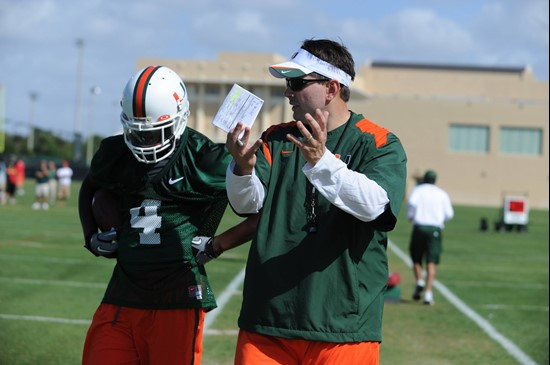 University of Miami Head Coach, Al Golden, instructs his team on how he wants them to execute his game plan during a spring practice at Greentree...