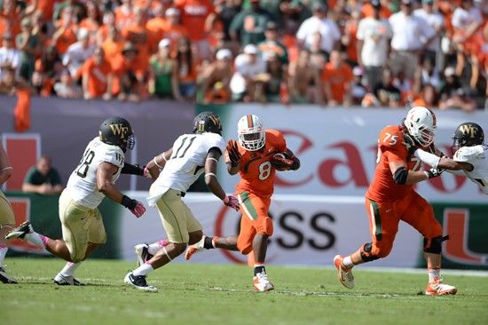 University of Miami Hurricanes running back Duke Johnson #8 carried the ball 30 times for 169 yards and scored two touchdowns in a game against the...