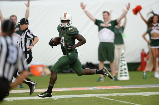 University of Miami Hurricanes wide receiver Phillip Dorsett #4 plays in a game against the Arkansas State Red Wolves at Sun Life Stadium on...