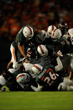 University of Miami players make a tackle in a game against the Virginia Tech Hokies at Dolphin Stadium on November 13, 2008.  Photo by Steven Murphy,...