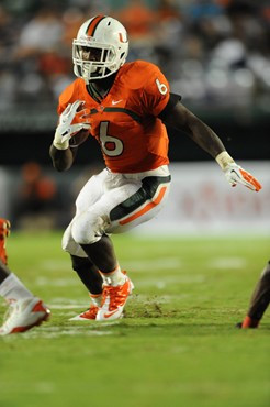 University of Miami Hurricanes running back Lamar Miller #6 carries the ball against the Ohio State Buckeyes at Sun Life Stadium on September 17,...