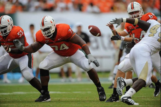 University of Miami Hurricanes offensive lineman Orlando Franklin #74 gets set to block against the University of Central Florida Knights at Dolphin...