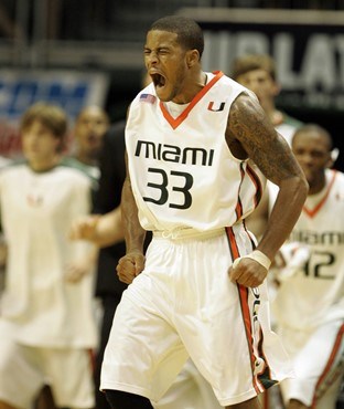 Jack McClinton celebrates a three-point basket during the second half. (AP Photo/Wilfredo Lee)