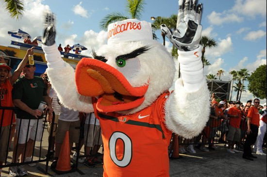 Sebastian the Ibis leads the University of Miami Hurricanes through a tunnel of cheering fans in a game against the Ohio State Buckeyes at Sun Life...
